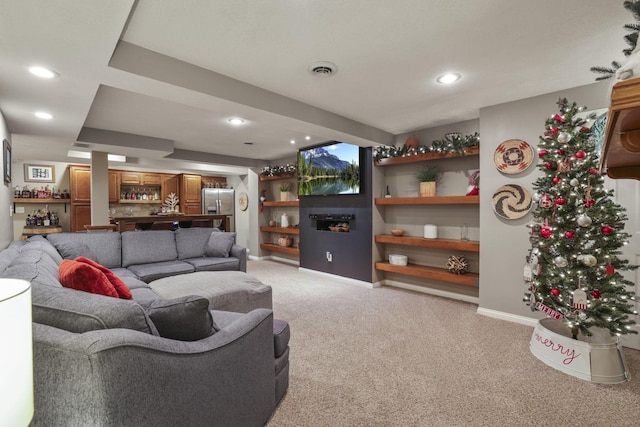 carpeted living room with bar