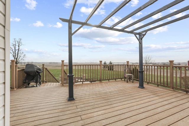 deck featuring a pergola, area for grilling, and a yard