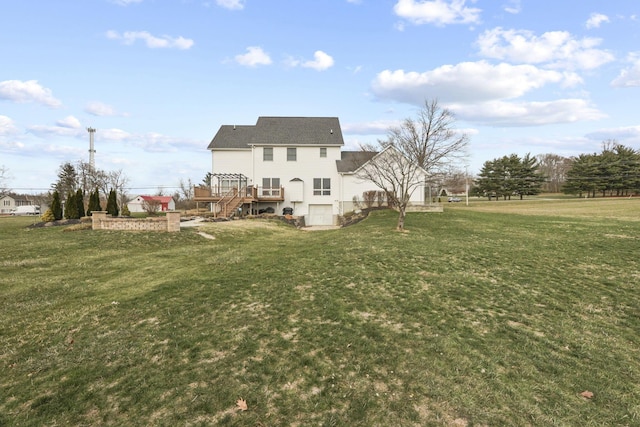 back of property featuring a deck and a lawn