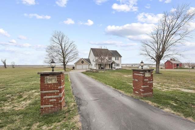 view of front facade with a garage and a front yard