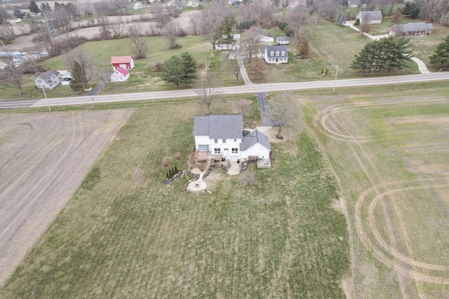 birds eye view of property featuring a rural view