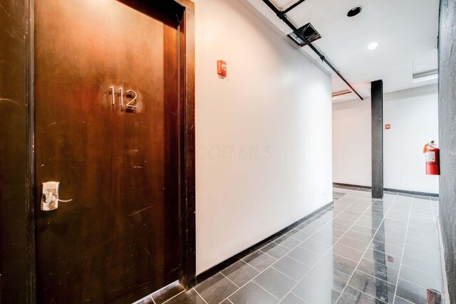 hall featuring tile patterned floors