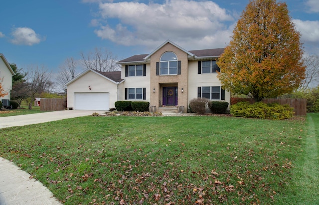 view of front of property featuring a garage and a front yard