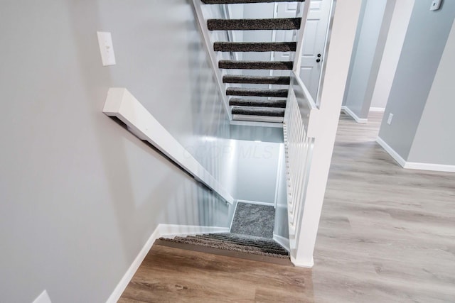 stairway with wood-type flooring