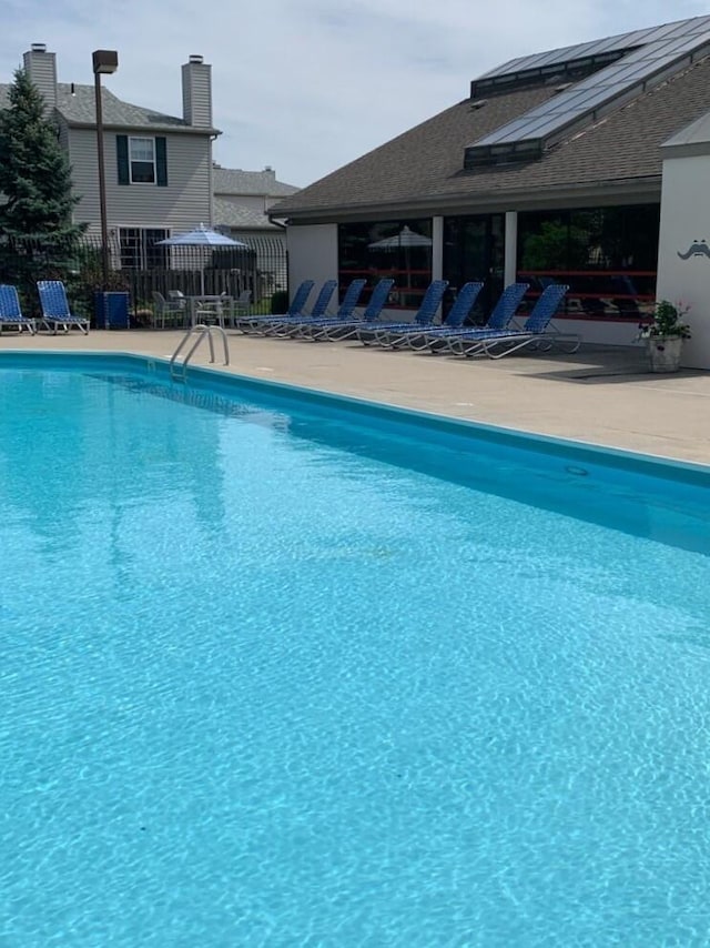 view of swimming pool featuring a patio area