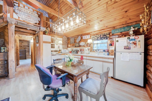 dining space featuring beam ceiling, wooden ceiling, log walls, and light hardwood / wood-style flooring