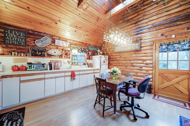 dining room with log walls, light hardwood / wood-style flooring, beamed ceiling, high vaulted ceiling, and wood ceiling