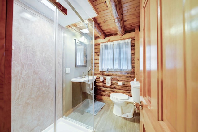 bathroom with beamed ceiling, wood-type flooring, toilet, a shower with door, and wood ceiling