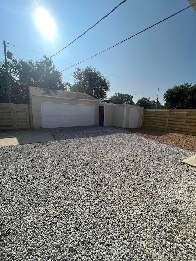 detached garage with fence