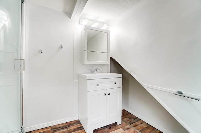 bathroom with vanity and hardwood / wood-style floors