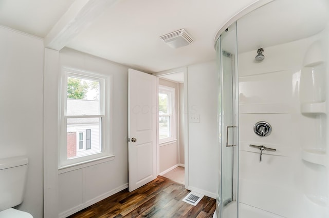 bathroom with a shower with door, wood-type flooring, and toilet