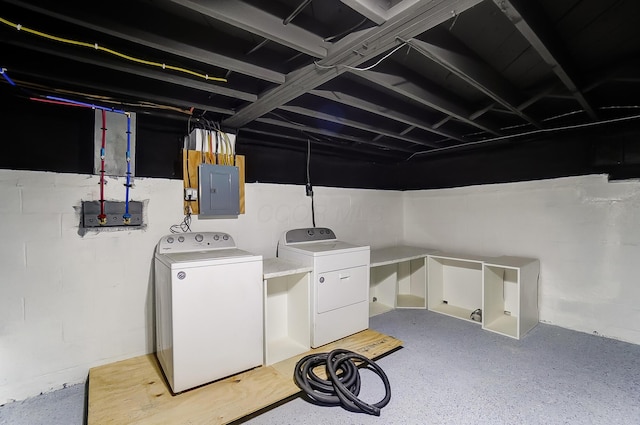 washroom featuring washing machine and clothes dryer and electric panel