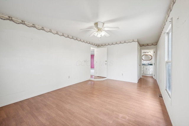 unfurnished bedroom with ceiling fan and light hardwood / wood-style flooring