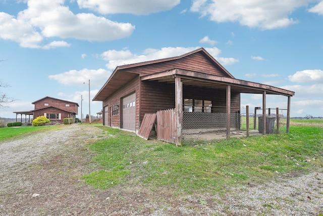 view of home's exterior with an outdoor structure