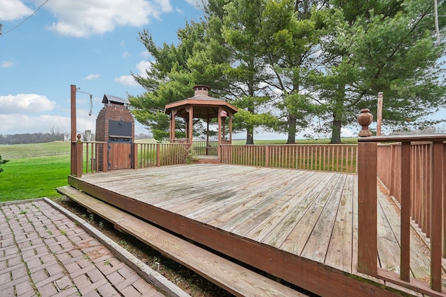 wooden terrace featuring a gazebo