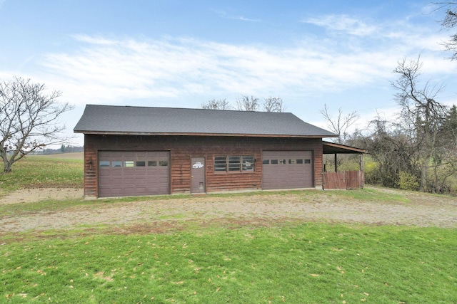 garage featuring a yard