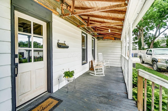 wooden terrace with a porch