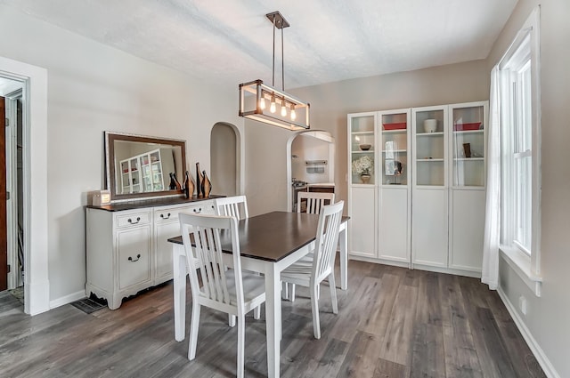 dining space featuring dark hardwood / wood-style floors