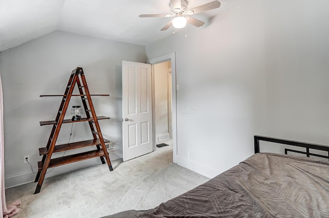 carpeted bedroom featuring lofted ceiling and ceiling fan