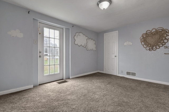 doorway with carpet floors