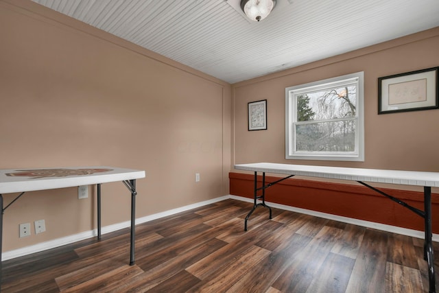 misc room with dark hardwood / wood-style floors and crown molding