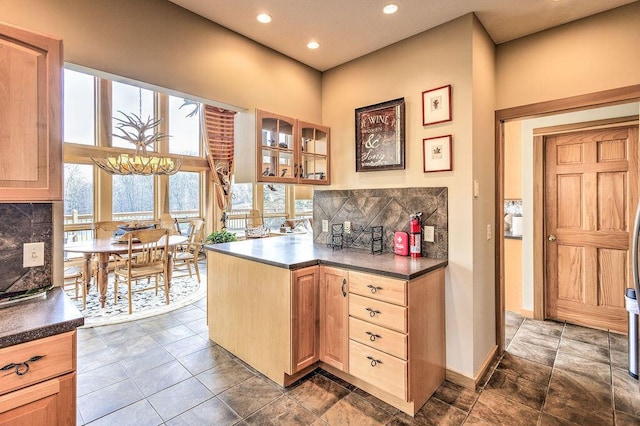 kitchen featuring decorative backsplash and light brown cabinets