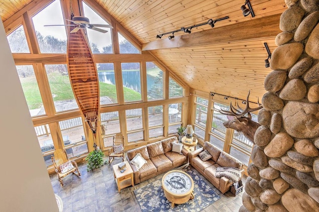 unfurnished living room featuring high vaulted ceiling, a water view, track lighting, and wooden ceiling