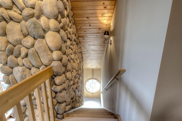 staircase with plenty of natural light and wood ceiling