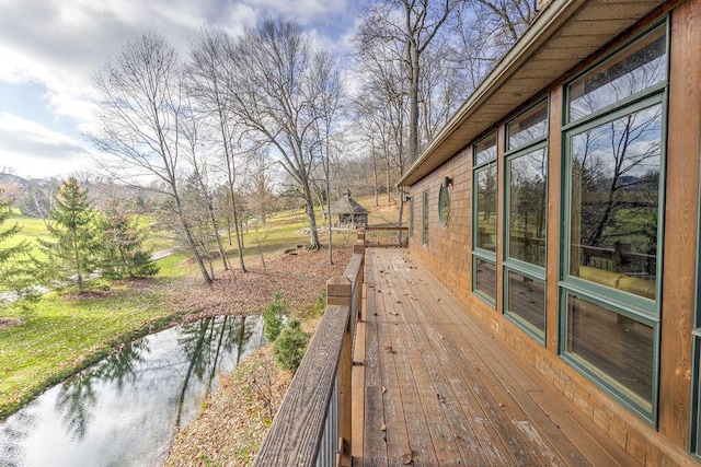 wooden terrace with a water view