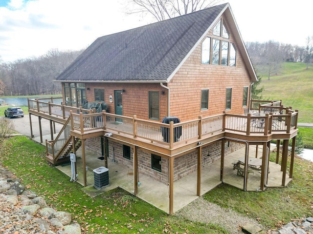 back of house with cooling unit, a patio area, and a deck