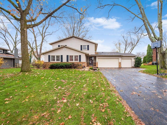 view of property with a front yard and a garage