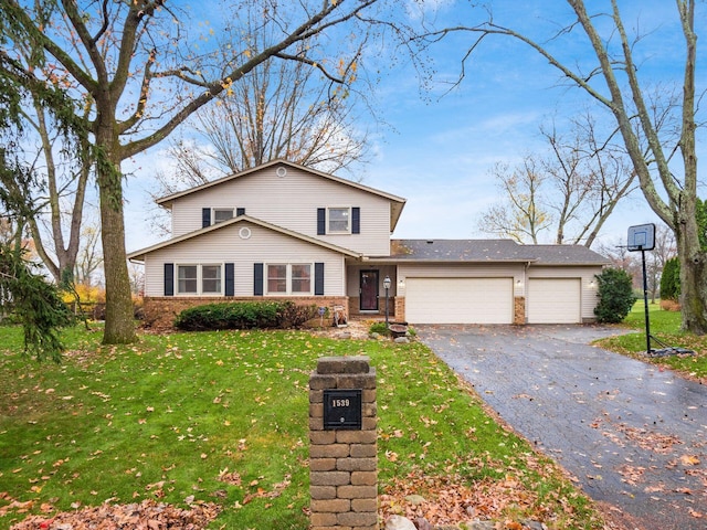 front of property with a garage and a front lawn