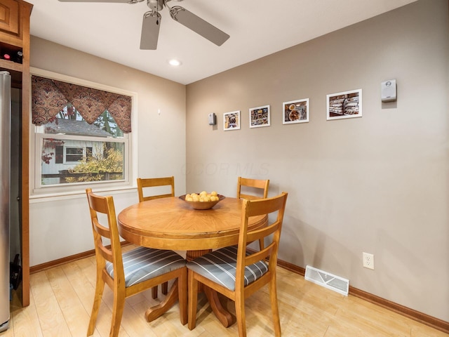 dining room featuring ceiling fan and light hardwood / wood-style flooring