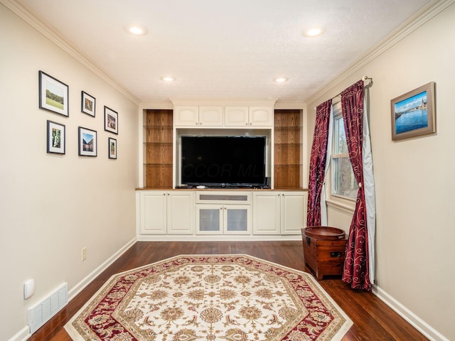 living room featuring dark hardwood / wood-style flooring and crown molding