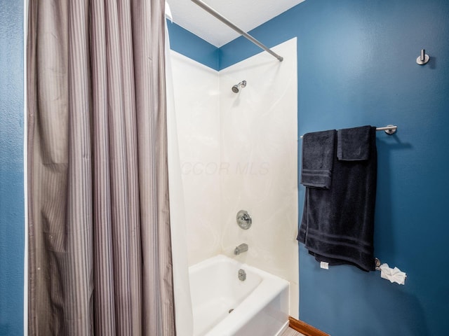 bathroom featuring shower / bath combination with curtain