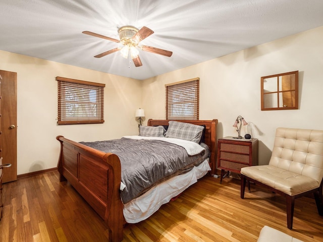 bedroom featuring hardwood / wood-style flooring and ceiling fan