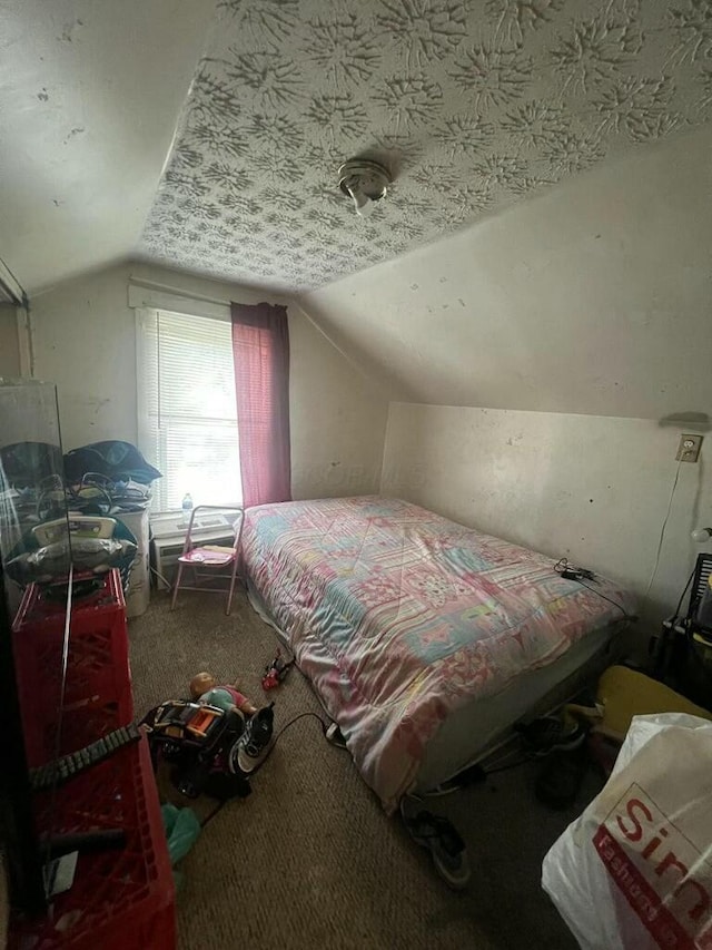 carpeted bedroom featuring vaulted ceiling