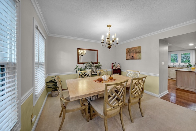 dining space with plenty of natural light, a chandelier, and a textured ceiling