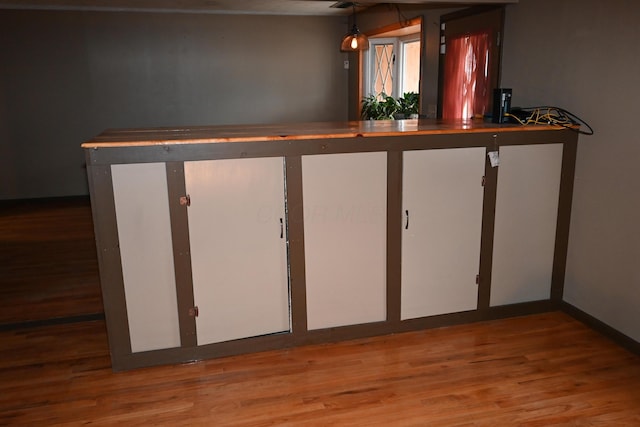 bar featuring hardwood / wood-style floors