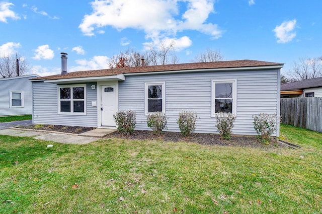 view of front of property with a front lawn