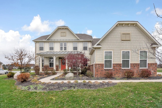 view of front facade with a front lawn and covered porch