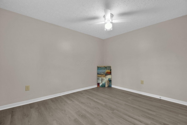 recreation room featuring a textured ceiling, hardwood / wood-style flooring, and ceiling fan