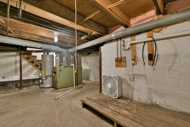 basement featuring heating unit and water heater