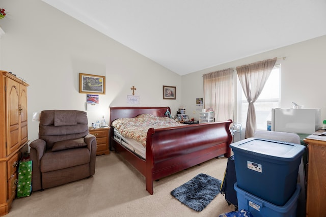 carpeted bedroom featuring lofted ceiling