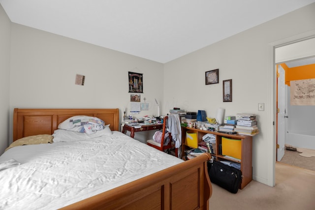 bedroom featuring light carpet