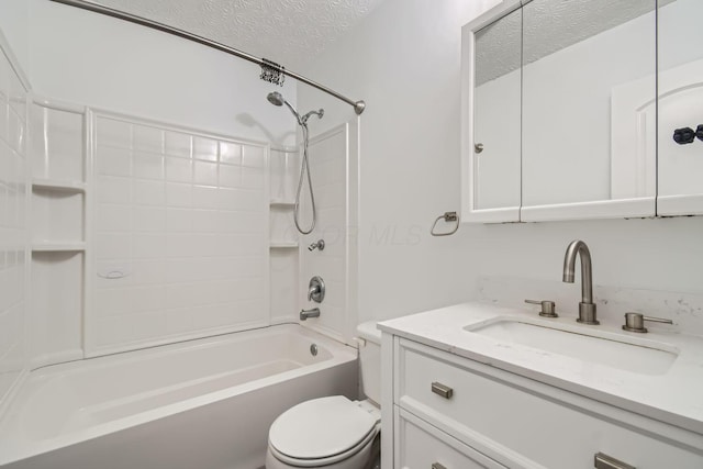 full bathroom with washtub / shower combination, vanity, a textured ceiling, and toilet