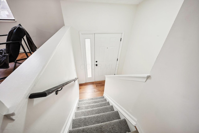 stairway with wood-type flooring