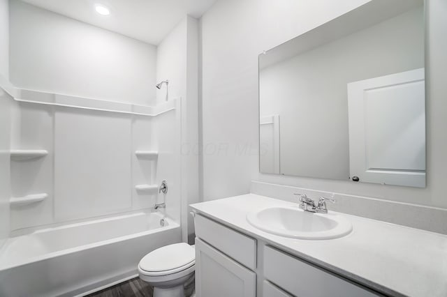 full bathroom with washtub / shower combination, vanity, and toilet