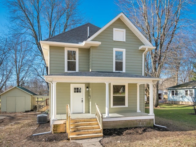 front of property featuring central AC, a porch, and a storage unit