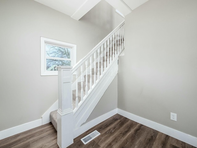 stairs with hardwood / wood-style flooring